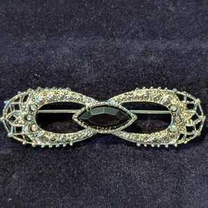 Elegant Silver and Black Brooch